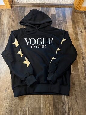 Fear of God Black Hoodie with White VOGUE Logo and Gold Sleeve Stars